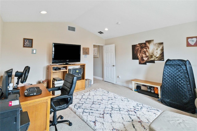 carpeted home office with lofted ceiling