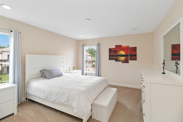 bedroom featuring light carpet