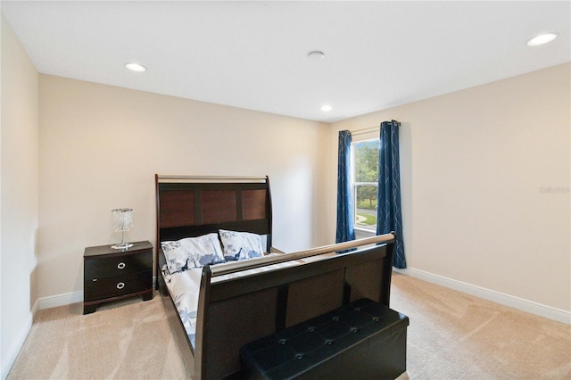 bedroom with light colored carpet