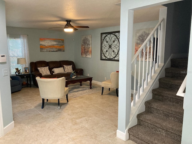 living room featuring ceiling fan