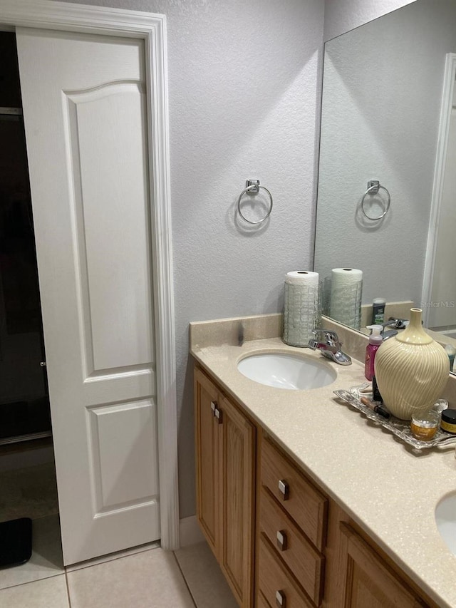 bathroom featuring vanity and tile patterned flooring