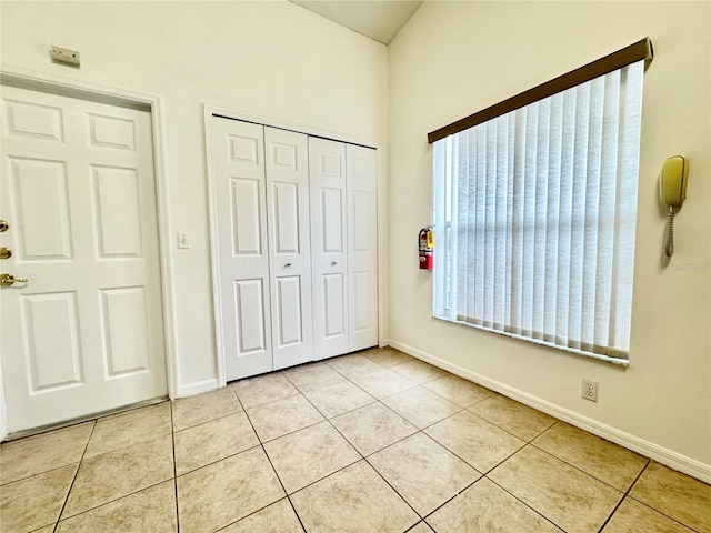 unfurnished bedroom featuring a closet and light tile patterned floors