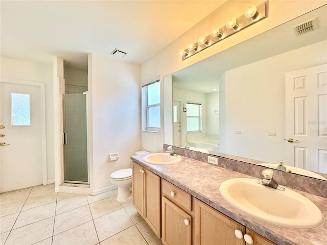 full bathroom featuring independent shower and bath, toilet, tile patterned floors, and vanity