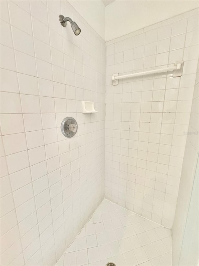 bathroom with a tile shower