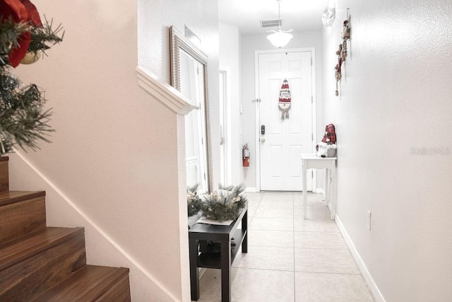 hallway with light tile patterned floors