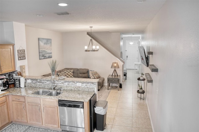 kitchen with light brown cabinetry, sink, hanging light fixtures, dishwasher, and kitchen peninsula