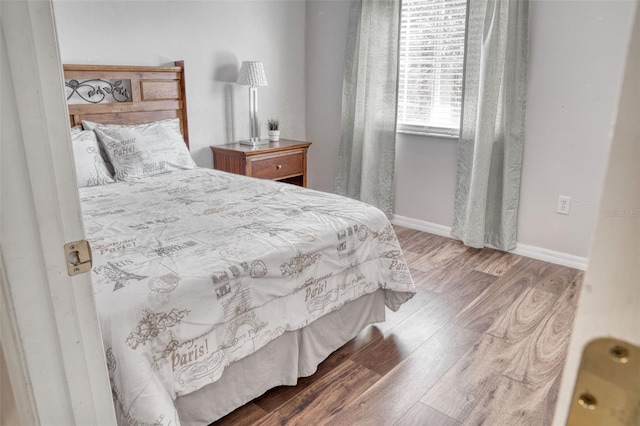 bedroom featuring wood-type flooring