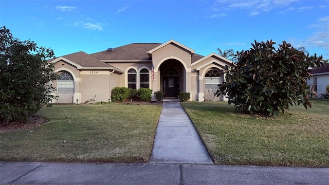 view of front of home with a front yard