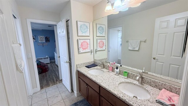 bathroom with tile patterned flooring and vanity