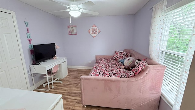 bedroom featuring light hardwood / wood-style floors and ceiling fan