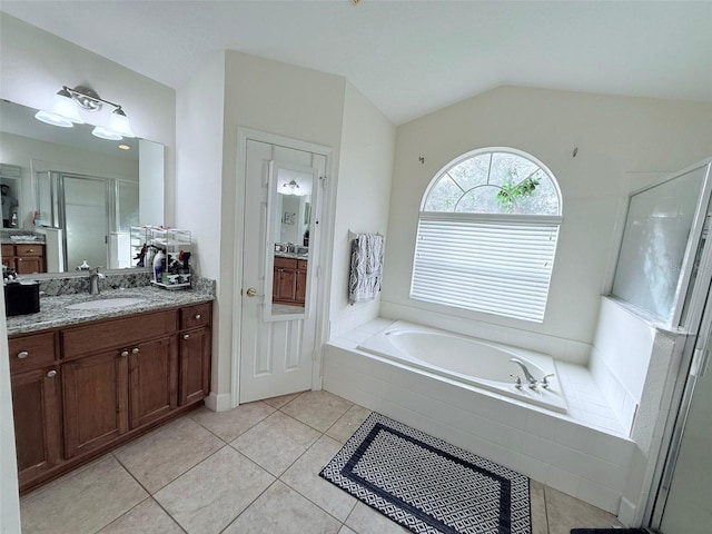 bathroom with vanity, shower with separate bathtub, tile patterned floors, and lofted ceiling