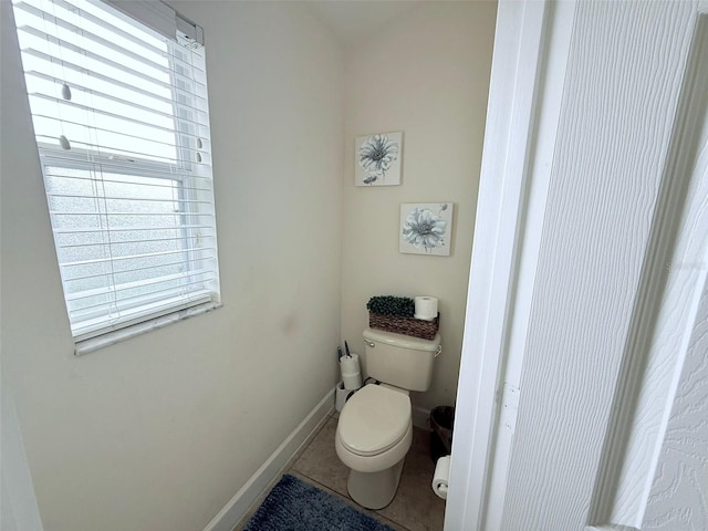 bathroom featuring toilet and tile patterned floors