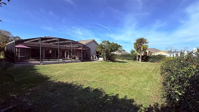 view of yard with a lanai and a patio