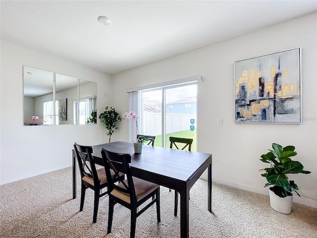 dining area featuring carpet floors