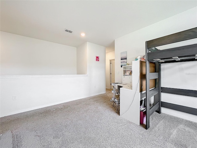 basement featuring light colored carpet