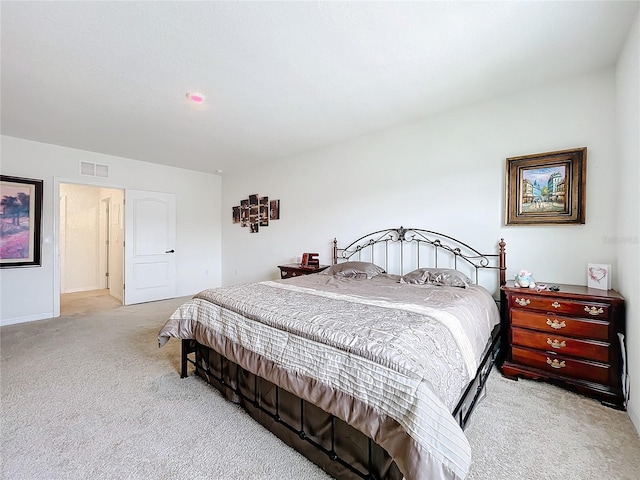 bedroom featuring light carpet