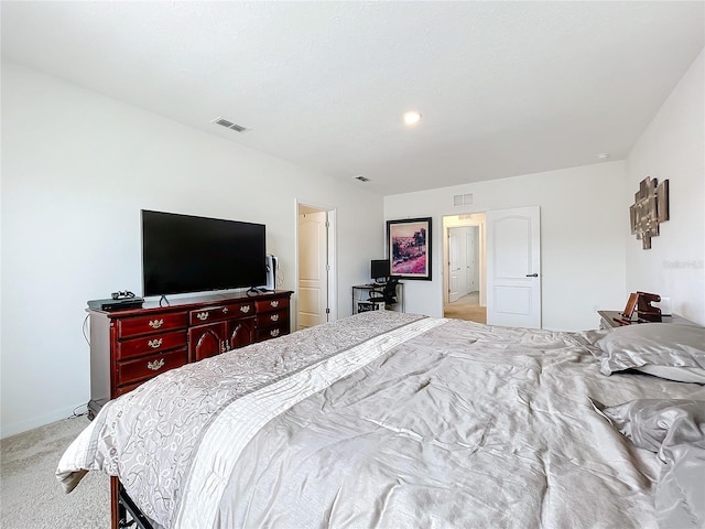 bedroom featuring light carpet