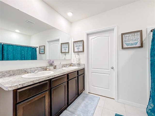 bathroom featuring tile patterned floors and vanity