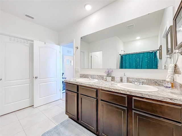 bathroom with vanity, a shower with shower curtain, and tile patterned flooring