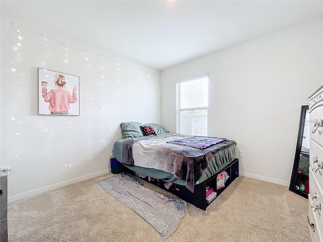 bedroom with light colored carpet