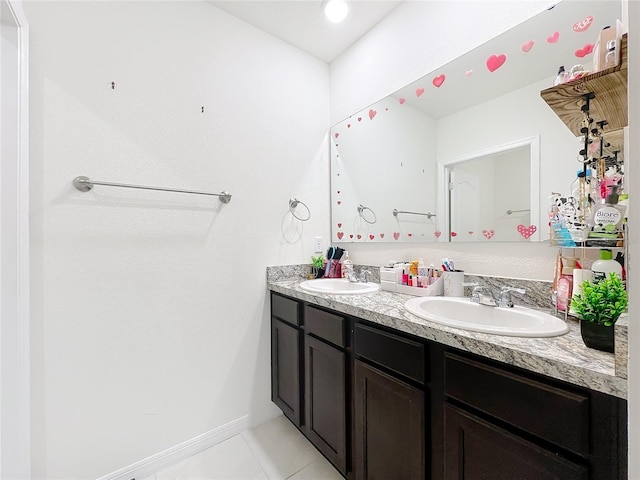 bathroom featuring tile patterned floors and vanity