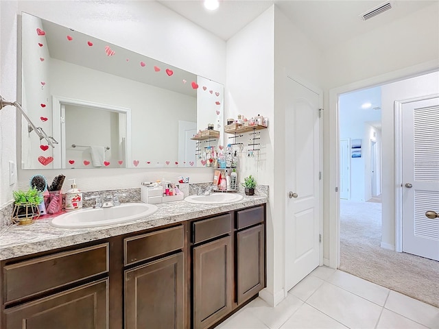 bathroom with vanity and tile patterned flooring