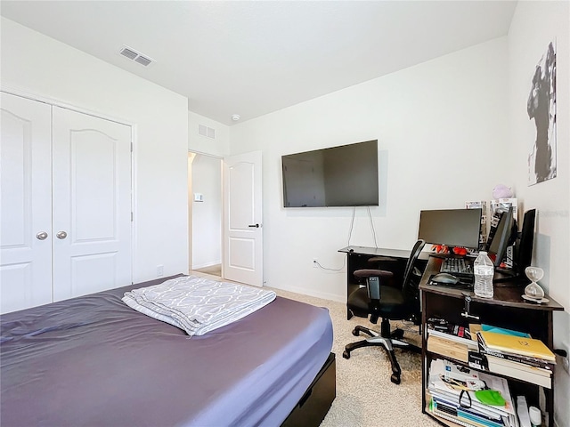 carpeted bedroom with a closet