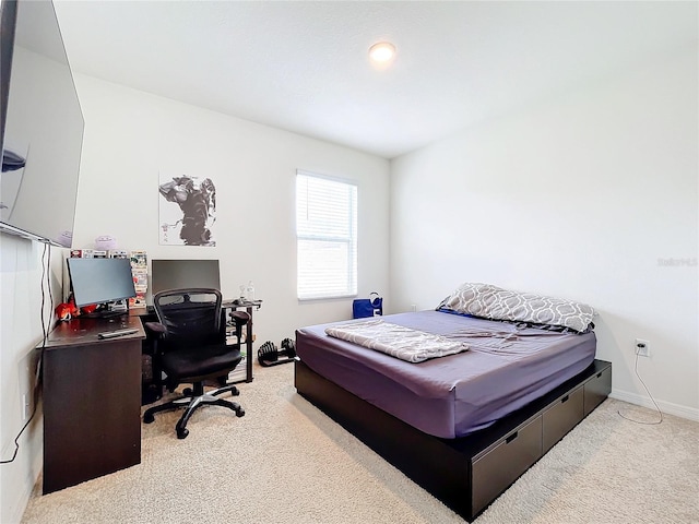 bedroom with light colored carpet