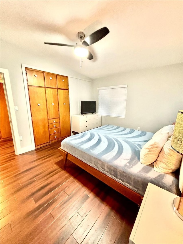 bedroom with ceiling fan and light hardwood / wood-style flooring