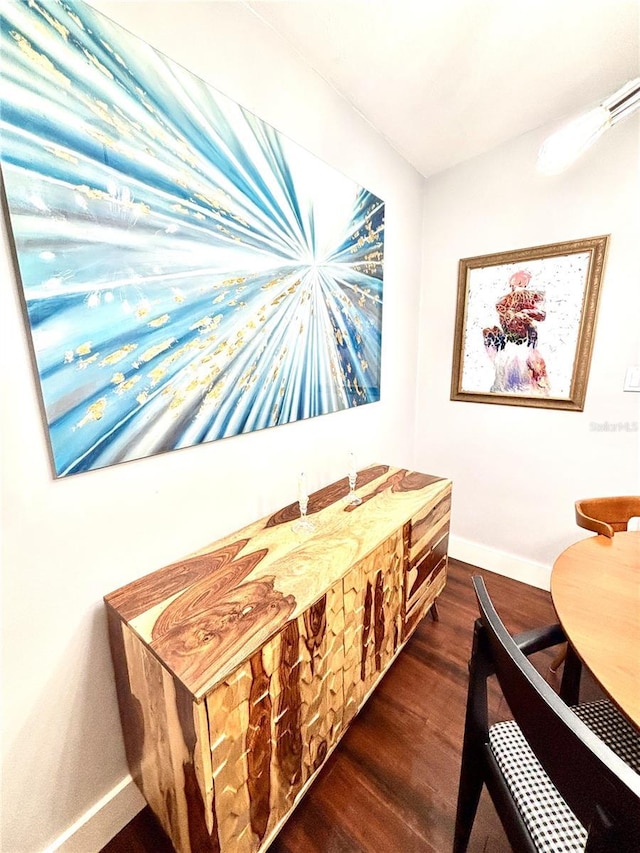 dining area featuring dark hardwood / wood-style floors