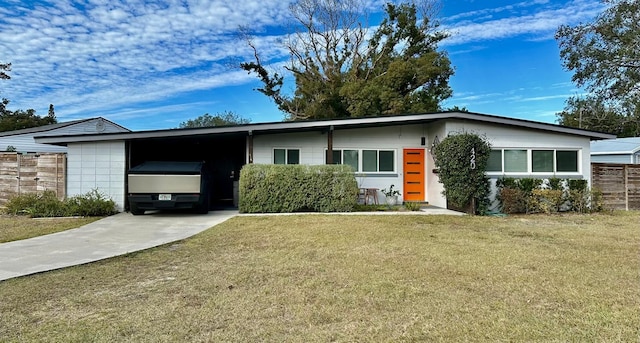 single story home featuring a carport and a front yard