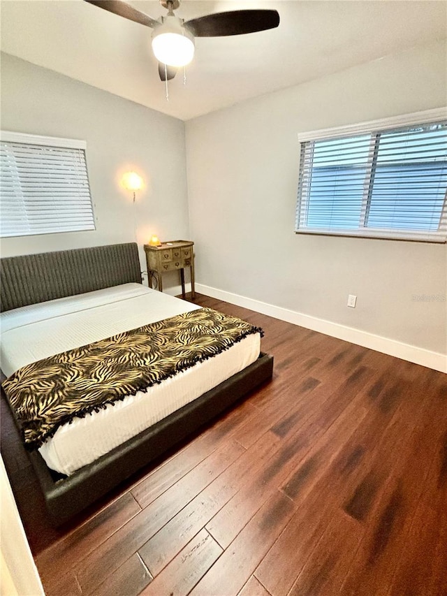 bedroom featuring hardwood / wood-style floors and ceiling fan