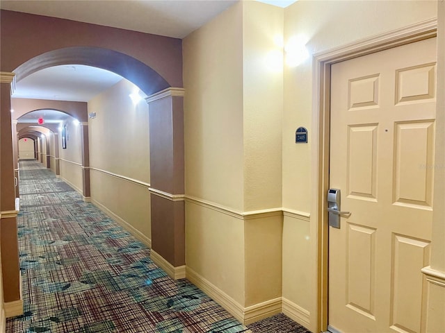 hallway with carpet floors