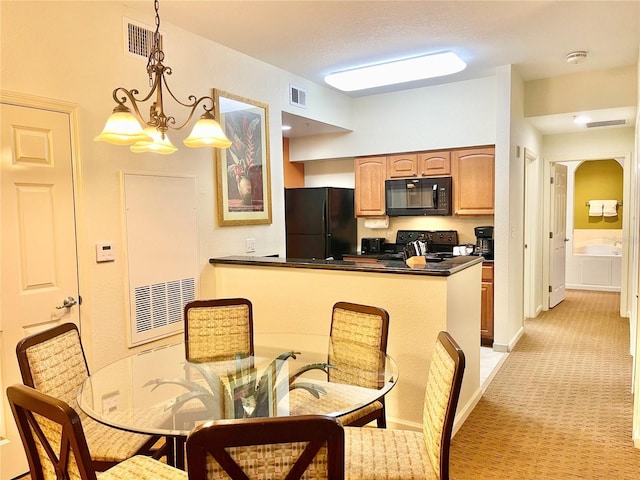 kitchen with pendant lighting, black appliances, light colored carpet, kitchen peninsula, and an inviting chandelier