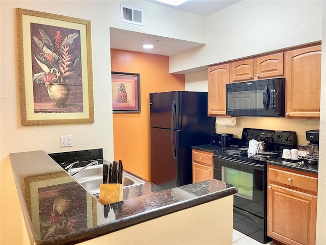 kitchen featuring sink, black appliances, kitchen peninsula, light tile patterned flooring, and dark stone counters