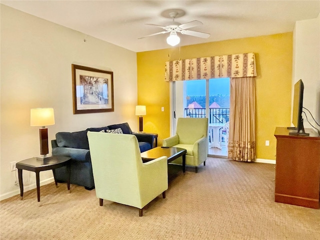 living room with ceiling fan and carpet flooring