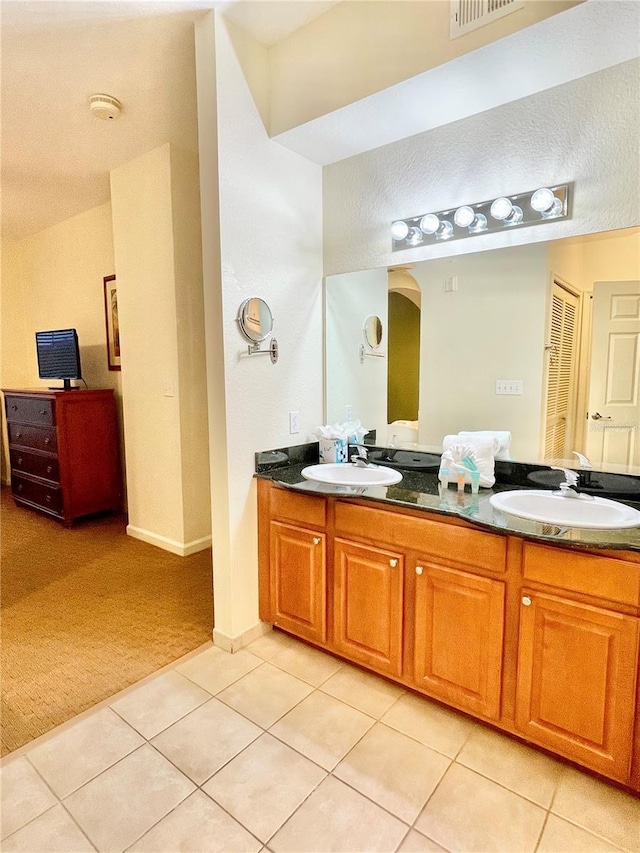 bathroom featuring vanity and tile patterned flooring