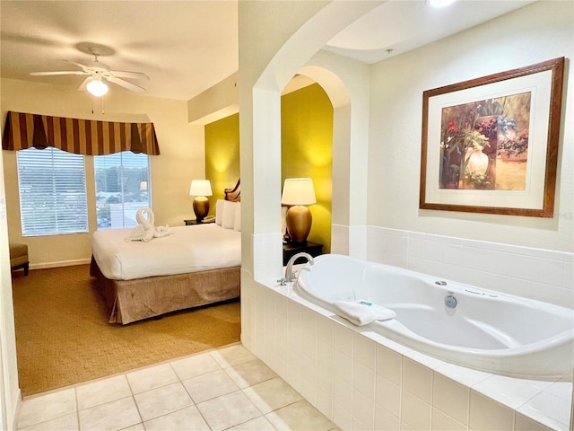 tiled bedroom featuring ceiling fan