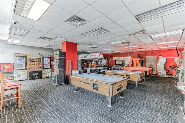 rec room with billiards and a drop ceiling