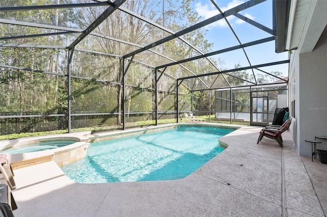 view of swimming pool with an in ground hot tub, a lanai, and a patio area