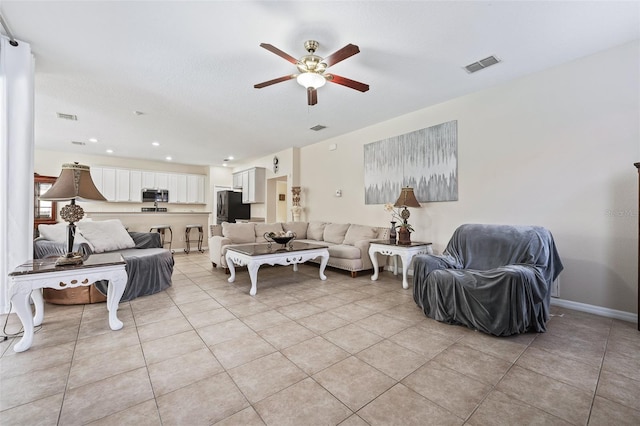 living room featuring light tile patterned flooring and ceiling fan