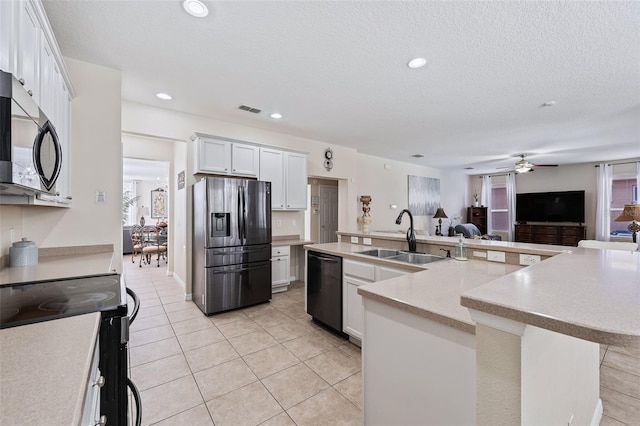 kitchen with dishwasher, sink, white cabinetry, fridge with ice dispenser, and an island with sink