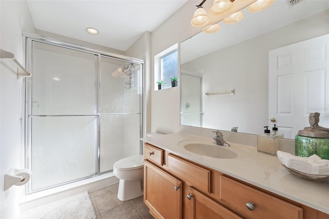 bathroom featuring an enclosed shower, tile patterned floors, vanity, and toilet