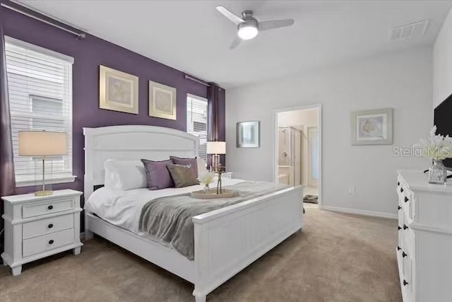 bedroom featuring carpet, connected bathroom, and ceiling fan