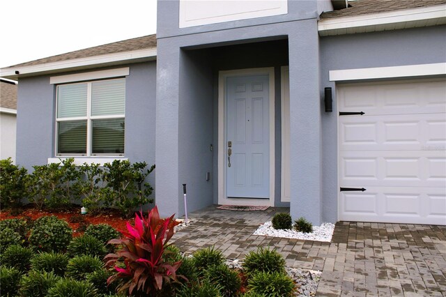 1280 Tupelo Trl, Haines City, FL 33844 - property entrance featuring a garage