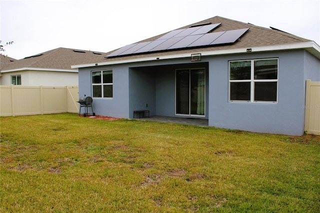1280 Tupelo Trl, Haines City, FL 33844 - rear view of house featuring a yard and solar panels