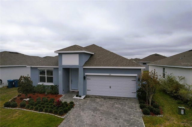 1280 Tupelo Trl, Haines City, FL 33844 - view of front of home featuring a garage and a front lawn