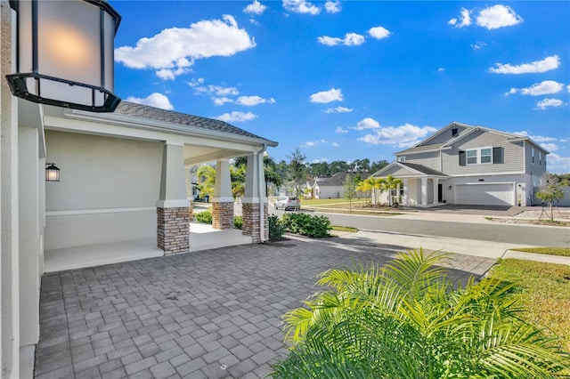 exterior space featuring driveway and an attached garage