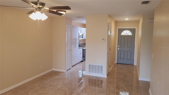 entryway featuring ceiling fan