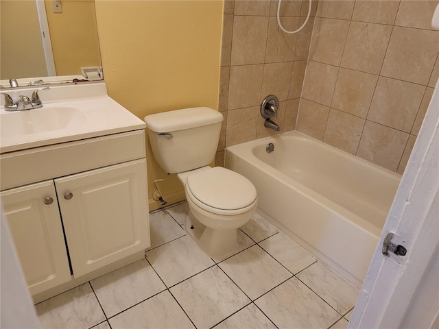 full bathroom with toilet, tiled shower / bath, tile patterned floors, and vanity